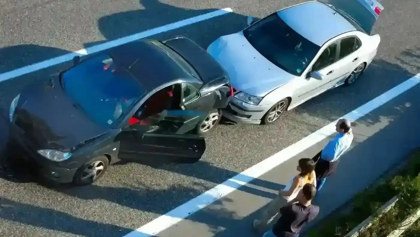 Rear-end car accident on highway.